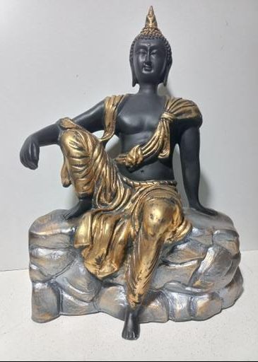 Golden Buddha Sitting on Stone